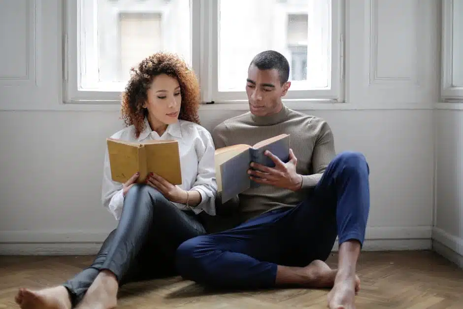 Couple reading books together, illustrating relationship counseling and communication skills.